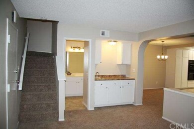 Wet bar, half bath & stairway