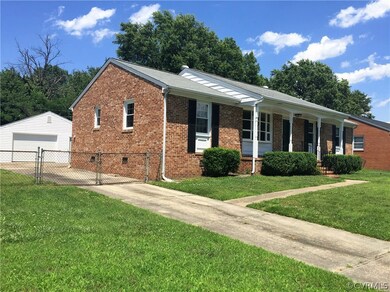 Three Bedroom Two Bathroom Brick Rancher on corner