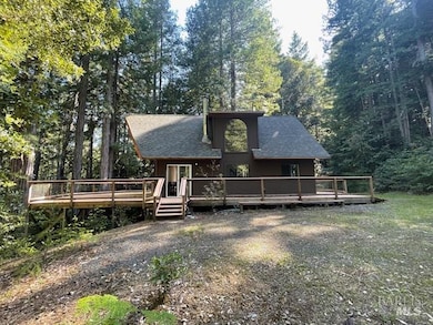 north side of the cabin. Big wraparound deck, nicely sited amongst the trees...