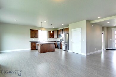 Entryway opens into large, open area including liv