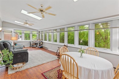 Stunning 4-season room with skylights and 3 walls 
