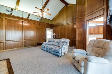 Paneled walls give the room a warm and inviting fe