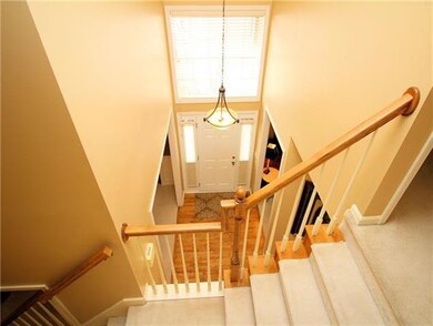 View from staircase landing to entry hall below