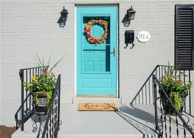 Fresh paint and a vibrant front door will welcome you home.
