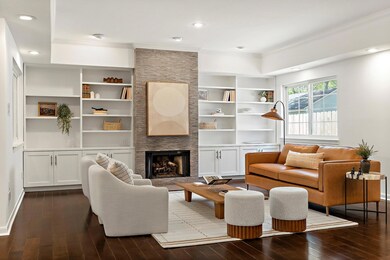 Living area featuring built in features, dark woo