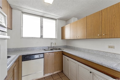 This kitchen features ample counter space and upper and lower cabinetry.
