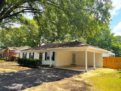 Single story home with a carport