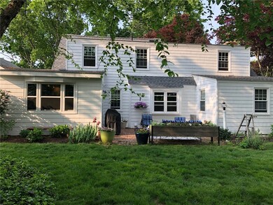 Rear yard is adorned with beautiful perennials.