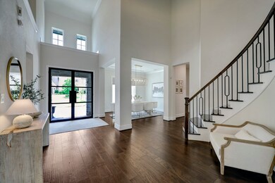 A large, formal entry showcases the natural light