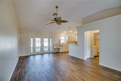 Great room open to kitchen and guest bath