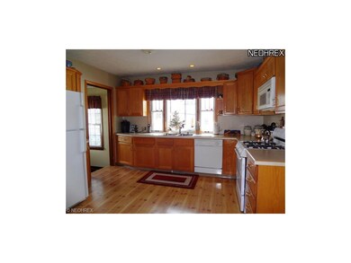 Gorgeous oak kitchen has lots of cupboard space, P