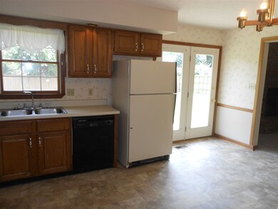 Kitchen offers all appliances.  Door opens to back