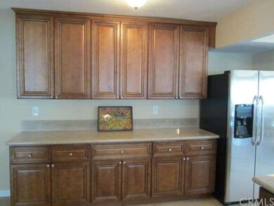 Lovely Dark Caramel Kitchen Cabinetry with Granite