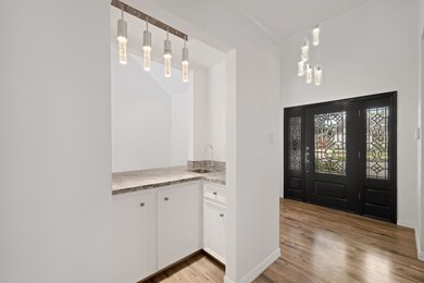 Check out the foyer with an amazing dry bar.