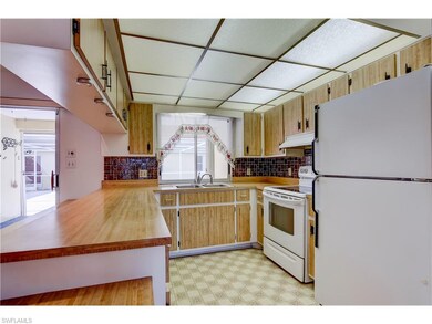 Kitchen View with Open through the pool Area!