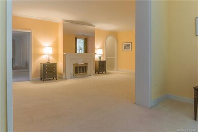 Living area from sunroom looking into formal dinin