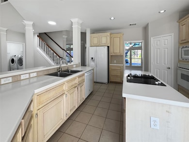 Large open kitchen with island. Fridge included.
