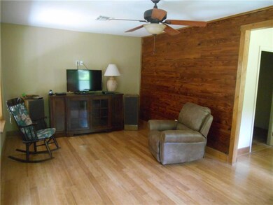 LIVING ROOM HAS A COUNTRY ATMOSPHERE WITH RECYCLED