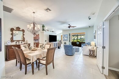 Dining area with light tile patterned flooring, vi