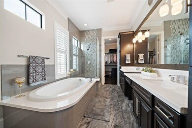 Extravagant master bathroom, double sinks, and jac