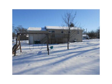 Exterior Back. Deep back yard with play set.