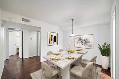 Dining area conveniently located next to the kitchen and open to the living room. Virtually staged.