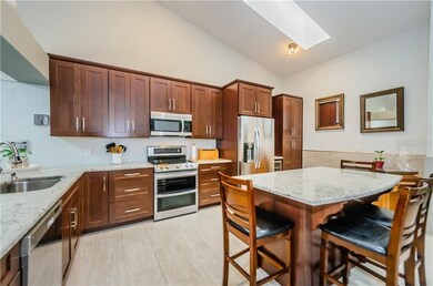 Gourmet Kitchen with island table seating, soft cl