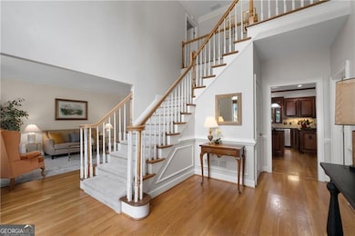 Hardwood floors in the spacious two-story foyer! A gorgeous staircase!