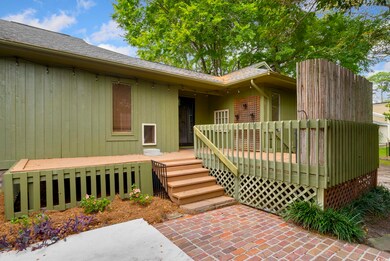 Doorway to property featuring a wooden deck