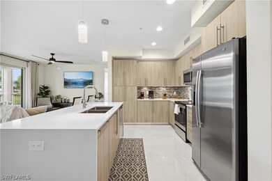 Kitchen featuring stainless steel appliances, hang