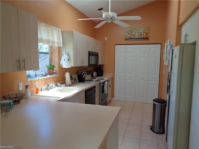 Kitchen featuring backsplash, light stone counters
