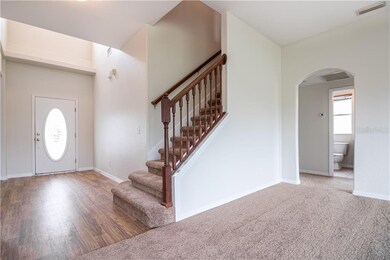 View of Entry Foyer and Stairwell from Family Room