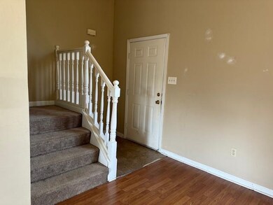 Entrance foyer with hardwood / wood-style floors