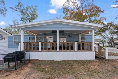Rear view of house with covered porch