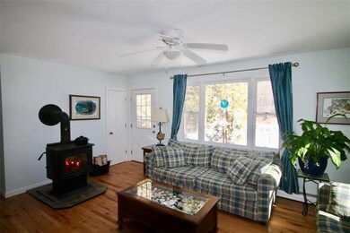 The living room with woodstove and...