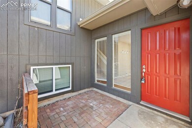 Property entrance with a patio