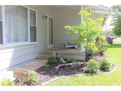 Front porch  is covered for anyone standing at the