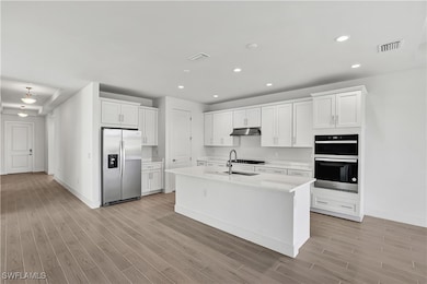 Gorgeous, kitchen layout with quartz countertops,
