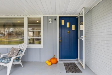 The combined charm of updated paint colors and that mid-century modern vibe of the original Front Door!