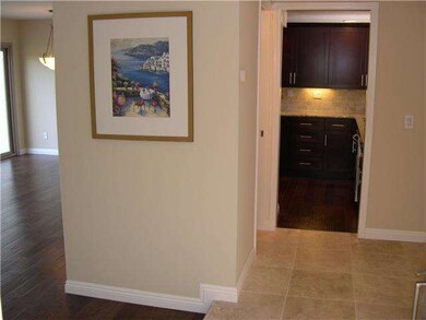 Travertine entry, new baseboards, and color coordi