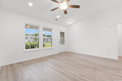 Empty room with vaulted ceiling, light wood-style flooring, a ceiling fan, and recessed lighting