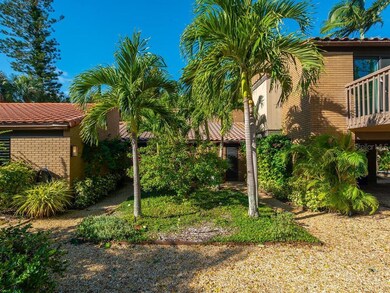 The front door is behind the clump of trees....ver
