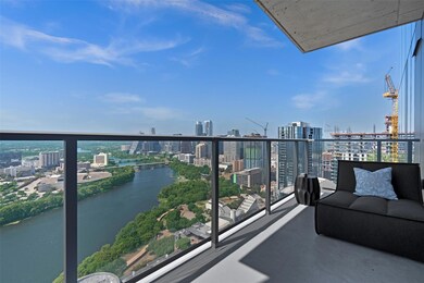 Balcony with a view of city and a water view