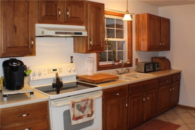 Galley kitchen with hardwood cabinets