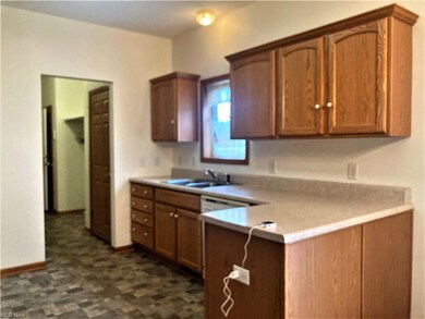 Kitchen has newer linoleum
