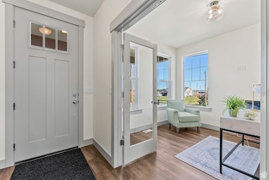 Foyer featuring wood finished floors
