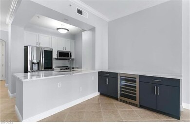 Kitchen featuring wine cooler, kitchen peninsula, 