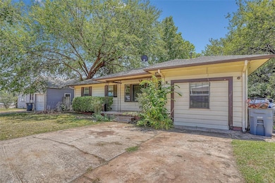 View of front facade with roof with shingles and a porch