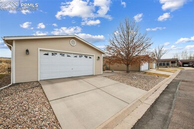 Garage featuring driveway