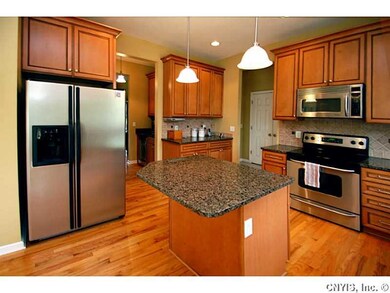 Kitchen. Perfect kitchen for entertaining. Large island, granite counter tops and stainless steel appliances.